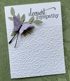 a close up of a greeting card with a paper butterfly on it's back