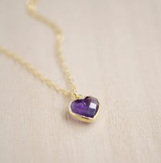 Give yourself some love or show your love for that special someone in your life with this heart necklace!Amethyst is believed to carry the energies of passion, creativity, and spirituality. It's also said to assist with temperance and sobriety, as well as inflammation.This necklace is handcrafted with a purple Amethyst faceted heart pendant. Each stone is natural and therefore contains natural inclusions or crystal formations. They are edged in 24k gold or silver electroplate. STONE SIZE: averag Heart-shaped Amethyst Yellow Gold Jewelry, Heart Cut Amethyst Jewelry For Gifts, Heart-shaped Yellow Gold Amethyst Jewelry, Heart Pendant Amethyst Jewelry As Gift, Heart Shaped Amethyst Pendant Jewelry As Gift, Amethyst Heart Pendant Jewelry As Gift, Everyday Spiritual Heart-shaped Necklace, Everyday Spiritual Heart Necklace, Amethyst Birthstone Heart Pendant Jewelry