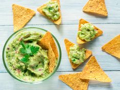 guacamole and tortilla chips on a table