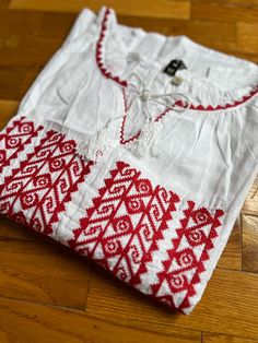 100% cotton Festive Cotton Shirt With Floral Embroidery, Traditional Floral Embroidered Festive Shirt, Traditional Floral Embroidery Festive Shirt, Red Cotton Shirt With Floral Embroidery, Beach Cotton Embroidered Shirt, White Embroidered Beach Shirt, White Embroidered Cotton Tunic Top, White Cotton Embroidered Tunic Top, White Embroidered Top With Embroidered Hem For Festival