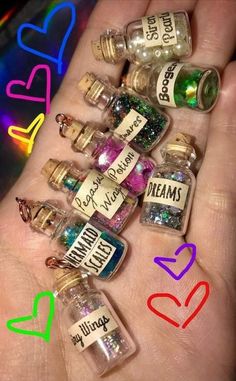 small bottles filled with lots of different types of things in it's palm area