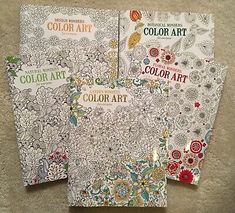 three coloring books with different designs on them