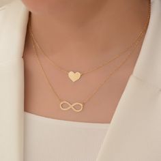 Express your love with our Handmade Heart Necklace crafted in 18K solid gold. This dainty heart pendant is the perfect gift for her, suitable for special occasions such as Valentine's Day, birthdays, and anniversaries.  heart size: 8mm* 8 mm  chain length: about  42 centimeters Material: 14k solid gold and also 10k and 18k gold Style: Minimalism Embrace minimalism with our elegant heart pendant that adds a touch of charm to any outfit. This timeless piece is designed to be cherished and worn every day. Customize your necklace by choosing your desired chain length at checkout. We include a resizable jump ring in the chain, allowing you to adjust it between 40 and 45 millimeters (16 and 17 inches) for the perfect fit. All our items come in an organza bag, making them ideal for gift-giving. I Mother's Day Double Heart Gold Plated Necklace, Minimalist Infinity Necklace For Valentine's Day, Gold Plated Double Heart Necklace For Mother's Day, Elegant Heart Charm Necklace As Gift, Heart Charm Infinity Necklace For Valentine's Day, Gold Necklaces For Valentine's Day Anniversary Gift, Infinity Heart Charm Necklace For Valentine's Day, Elegant Heart-shaped Charm Necklace For Gift, Gold Necklace For Valentine's Day Anniversary