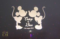 the top and bottom side of mickey mouse's silhouettes on display at an event