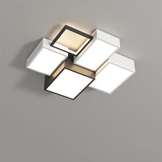 an overhead view of a ceiling light with square and rectangle shapes