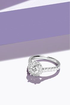 a white gold ring with a diamond in the center