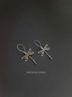 Beautiful silver dragonfly earrings with amethyst beads. Very detailed silver dragonflies are on handmade stainless steel ear hooks. Total earring length is just under 2 inches.  *Silver plated brass dragonflies  *Stainless steel ear hooks *Faceted amethyst beads  *Handmade with love <3 Like Jmesjewelrybox on Facebook for updates on new jewelry, upcoming sales and giveaways! Plus Facebook fans save 5% :D Find the coupon code on Jmesjewelrybox's cover photo https://www.facebook.com/Jmesjewelrybox Elegant Dragonfly Jewelry For Jewelry Making, Elegant Silver Dragonfly Jewelry, Elegant Sterling Silver Dragonfly Jewelry, Elegant Adjustable Dragonfly Jewelry, Purple Wire Wrapped Metal Jewelry, Purple Metal Earrings As Gift, Purple Metal Earrings For Gift, Handmade Purple Metal Earrings, Handmade Purple Metal Jewelry