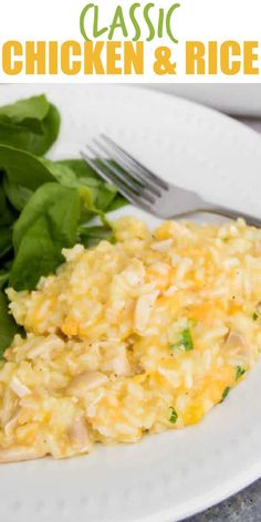 chicken and rice casserole on a white plate with spinach leaves next to it