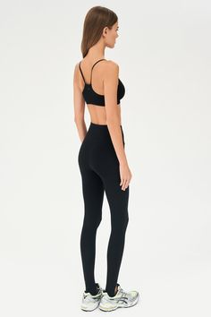 Our famous, form fitting high waist legging redesigned as a stirrup tight. Our ultra luxe Airweight fabric has a supremely soft hand and second skin comfort. BEST FOR: hot yoga, barre, Pilates. Model is 5'10" and wears a size small. Compressive High-waist Activewear With Built-in Bra, Fitted Seamless Pants For Pilates, Fitted Pants With Seamless Construction For Pilates, Compressive Seamless Pants For Pilates, Functional Fitted Leggings With Seamless Construction, Compressive Elastane Leggings With Seamless Construction, Versatile High Waist Black Tights, Compressive Seamless Elastane Leggings, Versatile High-waist Black Tights