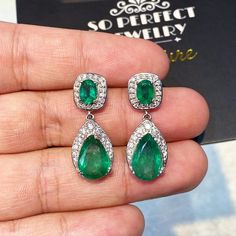 ONE OF A KIND HANDCRAFTED EARRINGS. IN STOCK! READY FOR SHIPPING! GIFT WRAP AVAILABLE! FREE UPS EXPRESS! DANGLING! GET THE PERFECT PIECE OF JEWELRY AS A CHRISTMAS GIFT FOR YOUR LOVED ONE! STUNNING 10.65TCW, Certified Zambian Emerald earrings. UNIQUE DESIGN! ONE OF A KIND! TRANSPARENT, SPARKLING EMERALDS IN PAIR! Extremely rare! Surrounded by TOP GRADE, F/VS DIAMONDS! Set in 18K solid white gold earrings. Our jewelry are specially designed, and are delicately handcrafted by local Thai, profession Aaa Quality Dangle Jewelry For Gifts, Aaa Quality Drop Earrings Jewelry Gift, High-quality Emerald Wedding Jewelry, Luxury Dangle Jewelry For Celebration, Aaa Quality Drop Earrings For Wedding, Elegant Aaa Quality Dangle Jewelry, Gia Certified Drop Jewelry For Formal Occasions, White Gold Hand Set Drop Earrings, Hand Set White Gold Drop Earrings