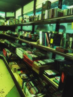 a room filled with lots of books on shelves