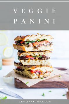 three grilled sandwiches stacked on top of each other with text overlay that reads, veggie panini