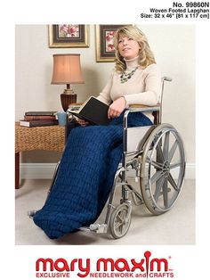 a woman sitting in a wheel chair holding a book