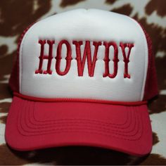 a red and white hat with the word showy embroidered on it