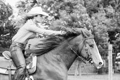 a woman riding on the back of a brown horse