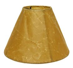 a lamp shade that is yellow and has brown paper on the bottom, with a white background