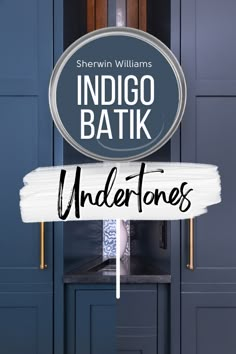 a sign that says indigo batik undertones in front of some blue cupboards