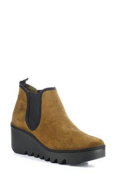 Fly London's signature wedge and a cushioned footbed elevate this this versatile Chelsea boot. 3" heel; 1 1/4" platform 3 1/2" shaft Pull-on style with elastic gore insets Cushioned insole Leather upper/synthetic lining/rubber sole Made in Portugal Women's Shoes Chelsea Boot Women, Fly London, Chelsea Boot, Boot Shoes Women, Arkansas, Chelsea Boots, Women's Shoes, Rubber Sole, Chelsea