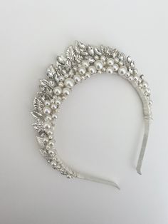 A beautiful combination of pearls and crystals framed by silver leaves. This design has elements of art deco style with a touch of woodland princess!   It measures 1.5 inches at the highest point. Each piece will be unique as I make them by hand for each customer - there will be slight  variations. If you would like me to send you a photo of your tiara before I post it, so that you can check you're completely happy with it, then please send me a message. SHIPPING AND PACKAGING- All Ivy and Pearl Woodland Princess, Crown Bridal Hair, Bride Hair Jewelry, Hair Accessories Wedding, Pearl Tiara, Hair Jewellery, Silver Leaves, Bride Hair, Wedding Hair Inspiration