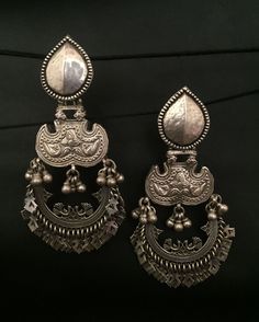 Product : Antique 92.5 Silver Earrings Handmade item (Earring) Style: Traditional Description:-  Antique silver 925, Gemstone Engagement , Anniversary , Honeymoon, First Date for Women, Traditional Earring - Jhumki , Gift for Her Metal :- SOLID 925 sterling silver  Weight- 46.6 Grams apx ( Earrings are same as shown in the pictures. We have only one piece in this style and colour, hence you get what you see in the picture ) Package - Individual gift wrapped box How to care:- The sterling material itself is soft, this ring band is thin, please avoid any serious collision and squeezing, because this may make the ring bent or stone fall out, we recommend you to buy a larger half size ring to make finger loose, this will avoid any squeezing. Handmade Jewelry By Vidita Jewels Contact us if any Antique Silver Earrings, Hippy Gifts, Traditional Earrings, Silver Earrings Handmade, Gemstone Engagement, Earring Jewelry, First Date, Engagement Anniversary, Silver Earring