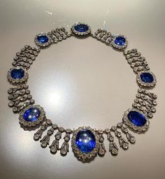 Vintage Queen Marie Amelies of France blue sapphire necklace in 915 sterling silver nd Cubic Zircon 17 inch long  Metal Purity:925 ⁵ Metal weight: 780.00 gram Stone :stimulated zircon CZ Clarity: AAAAA stone Ctw: 20.90ctw Gemstone: Blue sapphire  Gemstone creation: lab created  Item length:17.00 inch Item finished in 18k white gold plated on silver Luxury Sapphire Necklace Hallmarked, Classic Blue Diamond Necklace With 17 Jewels, Luxury Tanzanite Necklace With Brilliant Cut, Luxury Sapphire Necklace With Brilliant Cut, Blue Diamond Necklace With Jewels, Luxury Blue Jeweled Necklaces, Formal Blue Diamond Gemstone Necklace, Formal Blue Gemstone Diamond Necklace, Luxury Sapphire Gemstone Diamond Necklace