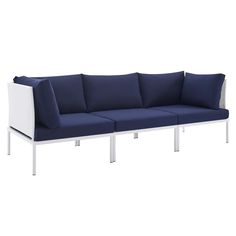 a white and blue couch with pillows on it's back end, against a white background