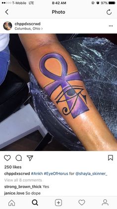 a person with a purple ribbon on their arm