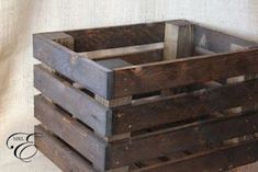 an old wooden crate is sitting on the floor