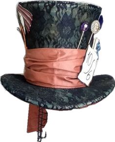 a hat with an orange ribbon around the brim and two pins attached to it