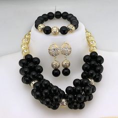 Enhance your bridal look with this classic Nigerian Wedding Bridal Jewelry. The African crystal beads jewelry set adds a touch of elegance and cultural significance to your wedding ensemble, creating a timeless and beautiful look. Elegant Pearl Jewelry Set For Gift, Silver Jewelry With Black Beads For Wedding, Black Crystal Jewelry Sets For Wedding, Elegant Beaded Wedding Sets, Black Polished Beads Necklace For Wedding, Black Polished Bead Necklace For Wedding, Elegant Black Jewelry For Marriage, Elegant Black Jewelry Set For Wedding, Elegant Black Jewelry For Wedding