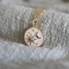 "Dainty moon and star charm necklace made of white enamel clear CZ stonemason and star pendant with skinny gold plated brass chain. Sweet and soft. A perfect gift for birthdays, anniversaries, bridesmaids, graduation, friendship, sisters, and for you! All items are packed individually in a gift box :) ★ Chain length 14\" - 20\" ★ Pendant 3/4\" ★ Gold filled pendant / Gold plated brass chain /White enamel / Cubic Zirconia  ★ Our production time is 1-4 business days ★ ★See more Nalydia jewelry  www.nalydia.etsy.com" White Pendant Jewelry With Sun And Moon Design, White Sun And Moon Pendant Jewelry, White Sun And Moon Design Pendant Jewelry, White Dainty Jewelry With Moon Charm, Dainty White Necklace With Moon Charm, White Celestial Moon Jewelry, White Moon-shaped Celestial Jewelry, White Moon Shaped Celestial Jewelry, White Sun And Moon Round Pendant Jewelry