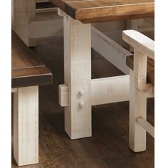 two wooden benches sitting next to each other on top of a hard wood floored floor