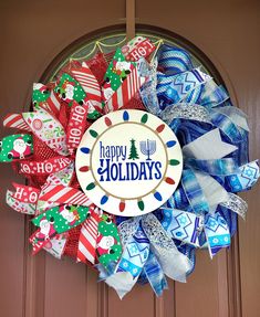 a wreath with the words happy holidays on it