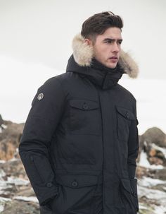 The Eldridge from the Men’s Saga Collection by Triple F.A.T Goose.  Made with premium fur and down that guarantees to keep you warm all holiday season. Functional Down Parka With Detachable Hood, Urban Nylon Parka For Cold Weather, Functional Down Parka With Double-lined Hood, Windproof Down Parka For Cold Weather, Weatherproof Down Parka For Outdoor Activities, Urban Down Parka With Detachable Hood, Functional Parka With Detachable Hood For Winter Sports, Functional Winter Parka For Cold Weather, Functional Down Parka For Winter