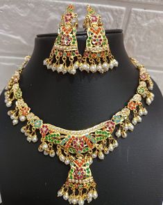 24k gold plated beautiful handmade jadau Necklace set made with craftmenship of our multi talented craftmen. Repolishable long lasting set. The product literally worth the price. Festive Multicolor 22k Gold Bridal Necklace, Ceremonial 22k Gold Meenakari Jewelry, Gold Meenakari Temple Jewelry Sets, Traditional Multicolor 22k Gold Necklaces, Traditional Multicolor 22k Gold Necklace, Multicolor 22k Gold Necklaces For Celebration, Gold Jewelry With Stone Work For Navratri, Gold Kundan Jewelry Set For Navratri, Festive Gold-plated Temple Necklace With Stone Work