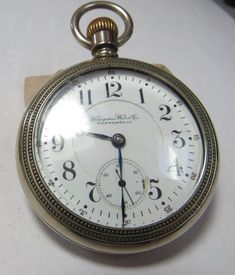 The Hamden John Hancock  antique watch was made in 1898. It is a open face  21 jewel. Has the s/n 1204179. Has 5 adjustments and is rail road grade. Comes with a silverine case and a double sunk dial. The dial where the second had is has a small repair at 3: Oclock. The piece runs but didn't check it for time. The movement has a wonderful engine turning design. Victorian Pocket Watch Chronometer For Anniversary, Antique Pocket Watch With Chronometer For Formal Occasions, Antique Chronometer Pocket Watch For Formal Occasions, Antique Pocket Watch With Chronometer For Formal Events, Antique Chronometer Watch, Antique Collectible Chronometer Pocket Watch, Antique Collectible Pocket Watch With Round Dial, Antique Round Pocket Watch With Antique Finish, Antique Chronometer Pocket Watch For Anniversary