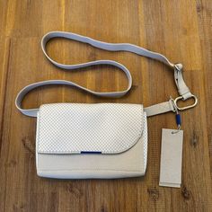 New With Tag Rothy’s Belt Bag White Rectangular Belt Bag For Everyday Use, White Everyday Shoulder Belt Bag, Everyday White Shoulder Belt Bag, White Shoulder Belt Bag For Everyday, White Flap Bag For Travel With Dust Bag, White Belt Bag With Adjustable Strap, White Belt Bag With Adjustable Strap For Daily Use, White Leather Shoulder Bag With Magnetic Closure, White Crossbody Belt Bag For Daily Use