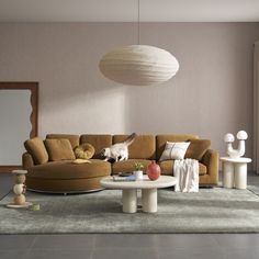 a living room filled with furniture and a large white ball hanging over the top of it