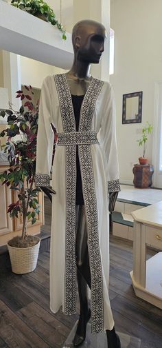 Basic information: White Chiffon Abaya / Kaftan / Thobe / Dress with Black Embroidery/Tatreez Modern Style with Embroidered / tatreez belt - Color : White & Black embroidery - Condition : NEW - Price : 65$ - size : 1 (Fits Small & Medium) Shoulders: 16" inches Sleeves Length: 24" Inches Abaya Length: 58" Inches - size : 2 (Fits Small & Medium) Shoulders: 16.5" inches Sleeves Length: 24" Inches Abaya Length: 58" Inches - Shipping : Free with USPS Priority Mail Shipping - No Returns & Exchange Acc Jordanian Dress, Dress Kaftan, Black Embroidery, Abaya Dress, Kitenge, White Chiffon, Arab Women, Eid Mubarak, Dress Clothes For Women