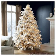 a white christmas tree in a living room