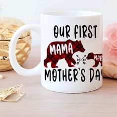 a mother's day coffee mug with a bear on it and the words our first mama