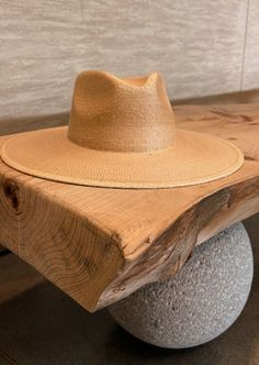 THE SUN-TANNED ORIGINAL RANCHER WITH A TRADITIONAL FIT... Crafted from 100% fine palm leaf straw, our hats boast an organic origin, making them not only environmentally friendly but also re-shapable, and water-shedding. The exceptional quality of our pure palm leaf hats is accentuated by their self-conforming feature, ensuring a personalized fit that effortlessly shapes to the contours of your head. Its easily moldable nature caters to the preferences of hat enthusiasts and milliners alike, addi Woven Toquilla Straw Hat With Flat Brim, Summer Fedora Panama Hat Made Of Palm Leaf, Natural Woven Toquilla Straw Fedora, Natural Toquilla Straw Woven Fedora, Natural Toquilla Straw Boater Hat, Handwoven Palm Leaf Panama Hat For Spring, Handwoven Toquilla Straw Fedora Summer, Natural Wide Brim Woven Fedora, Summer Fedora With Handwoven Flat Brim