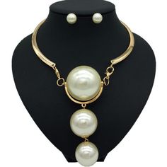 Description Here is a stylish Gold Pearl Necklace which not only modifies your look but also adds value to your personality. The Pearl has a soft glamour which makes it look very beautiful. There are two colors on this necklace available which are Gold and Silver. One can wear these necklaces for any occasion or ceremony. Features Material:Metal, Copper Alloy Pattern:Geometric Color:Gold /silver Pendant material:Pearl What Includes 1*Necklace 1 Pair ofEarrings Measurement Earrings Height: 0.90 i Chic White Choker Jewelry, White Alloy Choker Jewelry, White Alloy Necklace For Party, White Alloy Necklaces For Party, Elegant Alloy Necklaces For Party, Pearl White Dangle Jewelry For Party, Elegant Party Necklaces In Alloy, Chic Pearl Choker Jewelry, White Metal Necklace For Party