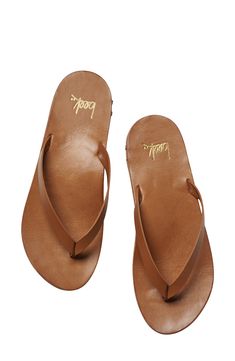 Lounge by the poolside in luxe style with this smooth leather flip-flop boasting arch support and a grippy rubber sole for steady strides. Arch support Leather upper and lining/rubber sole Made in Brazil Leather Round Toe Flip Flops For Beach, Leather Toe Post Flip Flops For Vacation, Brown Summer Surfing Flip Flops, Brown Flip Flops With Arch Support For Summer, Summer Vacation Flip Flops With Leather Lining, Classic Leather Footbed Flip Flops For Vacation, Summer Vacation Leather Lined Flip Flops, Brown Sandals For Surfing In Summer, Classic Flip Flops With Single Toe Strap For Vacation