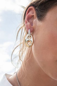 These earrings are made with 999 pure silver (the highest purity of silver) and 18k gold plated. The hoops are microset with cubic zirconia. We are using innovative technique to make them light and very comfortable to wear.2-year worldwide warranty Material: 999 Pure Silver (99.9% purity), 18k gold plated, white cubic zirconia All our products are handcrafted and microset by hand in our ateliers Color: Yellow Gold Size: Medium (Length: 4 cm ; Width : 2 cm) Modern Gold Earrings With Pave Setting, Modern Gold Diamond Earrings With Pave Setting, Modern Gold Hoop Earrings With Pave Setting, White Gold Plated Sterling Silver Hoop Earrings, Luxury Everyday Earrings With Pave Setting, Gold White Topaz Earrings With Prong Setting, Modern Gold Jewelry With White Topaz, Luxury Sterling Silver Plated Hoop Earrings, Luxury Everyday Silver Earrings With Pavé Setting