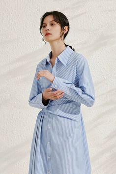 French Chic with Striped Shirt Dress Elegance Step into the world of French artistry with our Wrap Waist Stripe Shirt Dress. Made of 100% cotton, it boasts a delicate drape and smooth touch. The wrap waist design enhances its casual yet feminine vibe. Style #: WWSI368