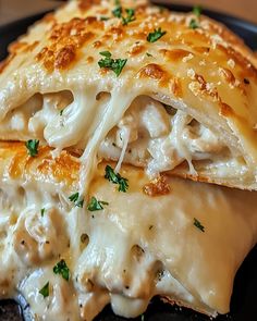 a close up of a plate of food with meat and cheese on it's crust