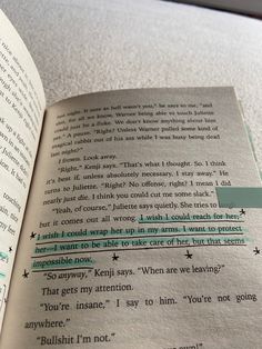 an open book with some type of text on the page and green highlight tape around it