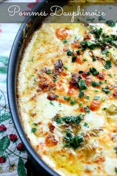 a casserole dish with cheese and vegetables in it