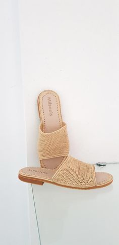 The must have raffia sandals ethically handmade in Morocco. Hand-crafted by artisans in Morocco Upper: 100% Raffia Fiber Please not any minor imperfection is a reflection of the hand-made process and only add to the beauty and uniqueness of the product. ------------------------Size Conversion & Summer Slip-on Mules With Woven Sole, Beige Closed Toe Slides For Beach, Beige Closed Toe Slides For The Beach, Beige Closed-toe Slides For The Beach, Beach Sandals With Woven Jute Sole, Natural Jute Sandals With Woven Sole, Natural Woven Straw Mules, Casual Straw Mules In Natural Color, Beige Woven Straw Mules